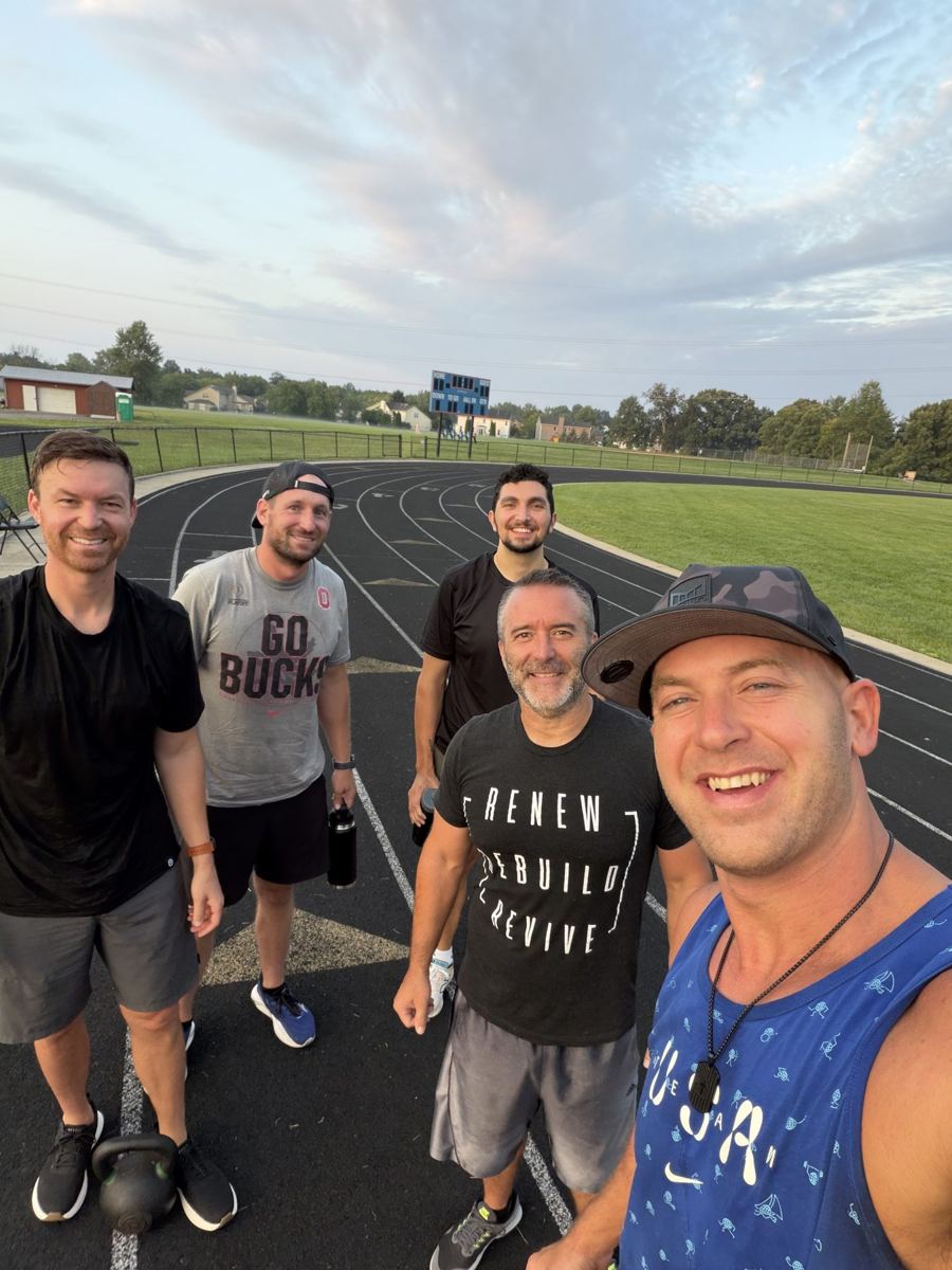 Group selfie on the track with kettlebells