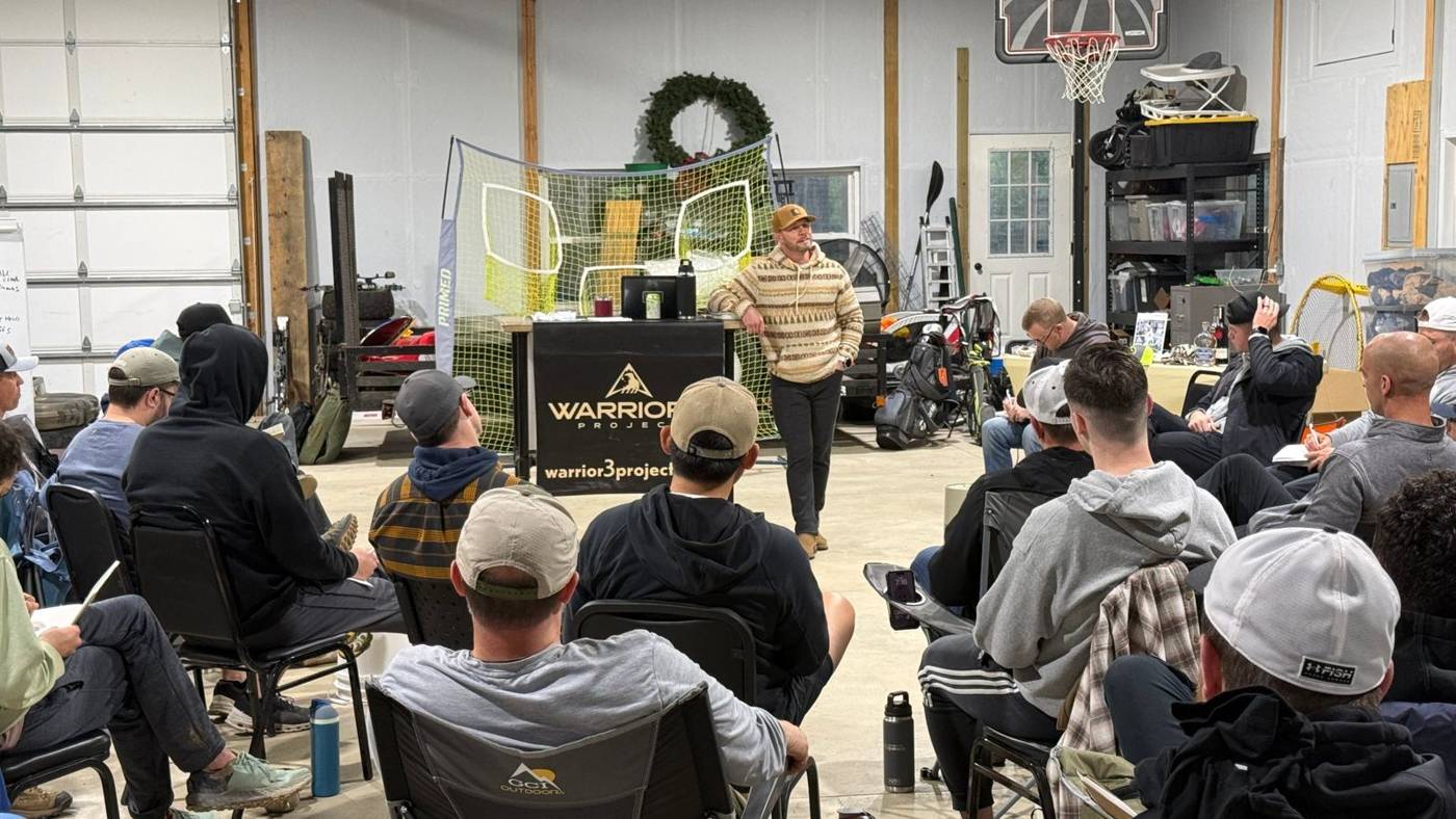 A speaker teaching in front of the group
